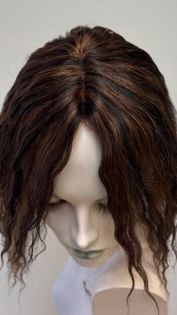 A close up of the front of a wig