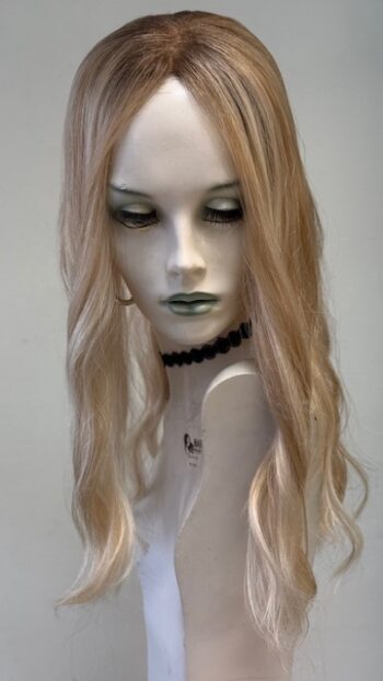 A mannequin with long blonde hair and green eyes.