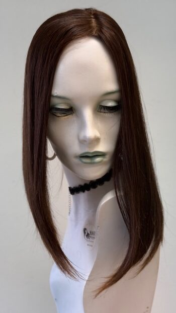 A mannequin with long hair and green eyes.