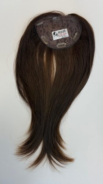 A brown wig with long hair on top of it.