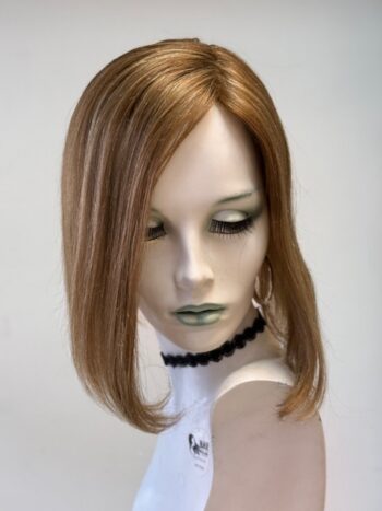 A mannequin head with a wig on it