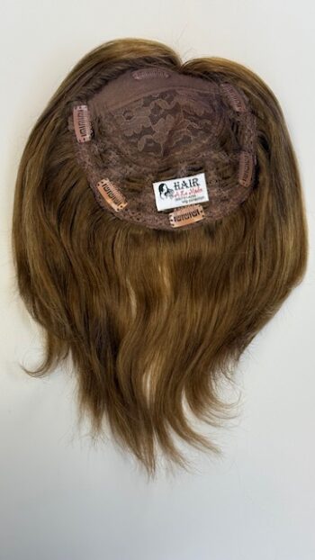 A wig is shown with long hair on top of it.