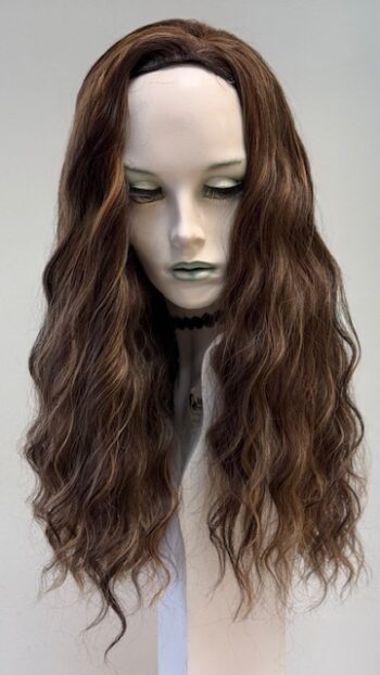 A mannequin with long brown hair and green lipstick.