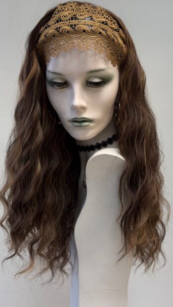 A mannequin wearing a wig and necklace.