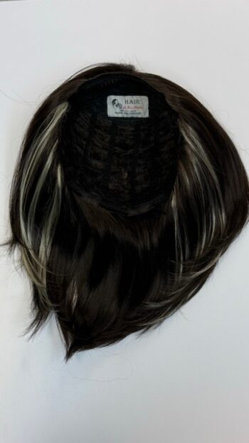 A black wig with white highlights on top of it.