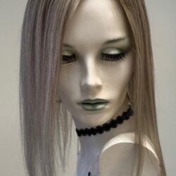 A mannequin with long blonde hair and black necklace.