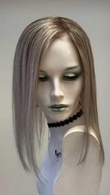 A mannequin with long blonde hair and black necklace.