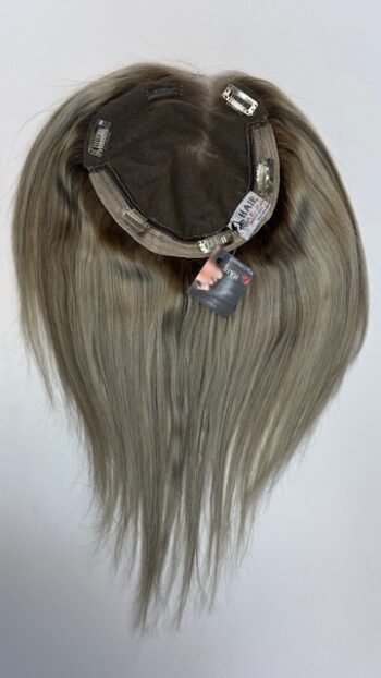 A wig is shown with tags attached.