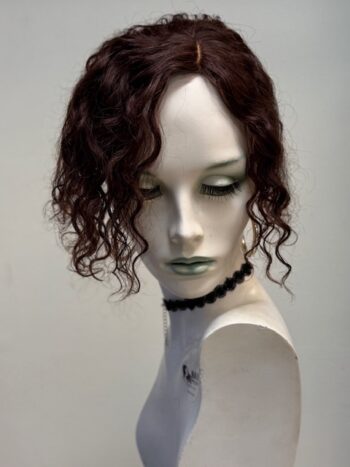 A mannequin with long hair and green eyes.