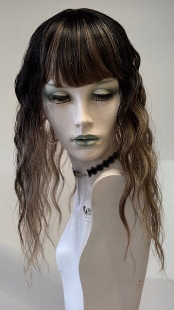 A mannequin with long hair and bangs.