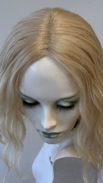 A close up of the face of a doll