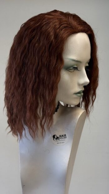 A mannequin with long brown hair and green eyes.