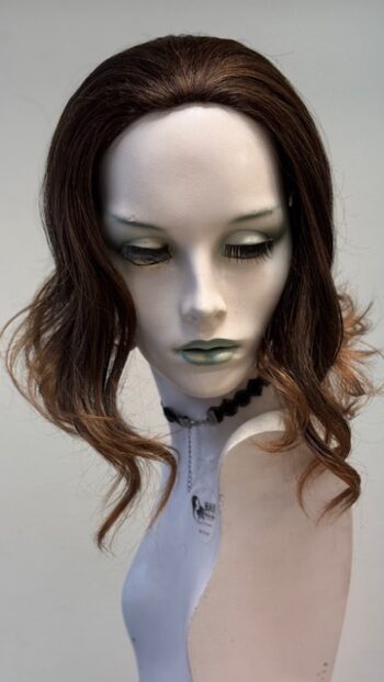 A mannequin with long hair and green eyes.