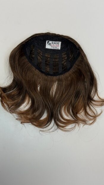 A close up of the back of a wig