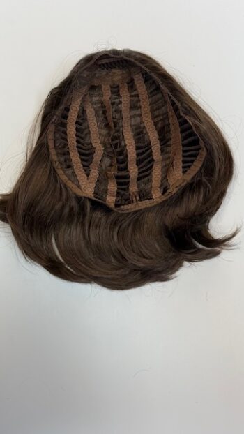 A close up of the back of a wig