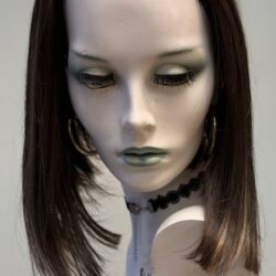 A mannequin with long hair and green eyes.