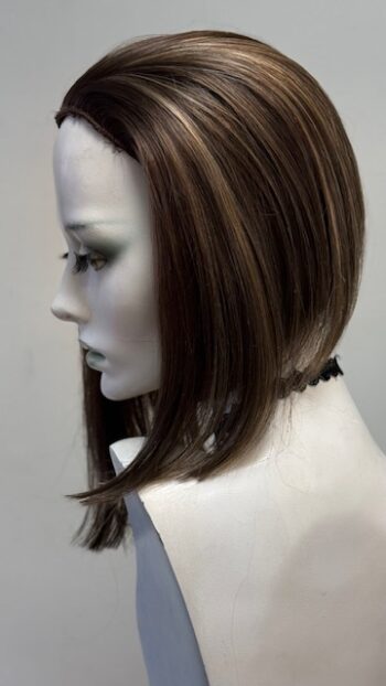 A mannequin with long hair and a black necklace.