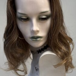 A mannequin with long hair and green eyes.