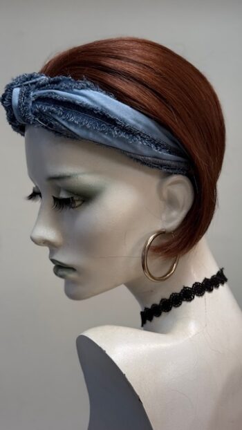 A mannequin with a head scarf on