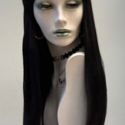 A mannequin with long black hair and green lipstick.