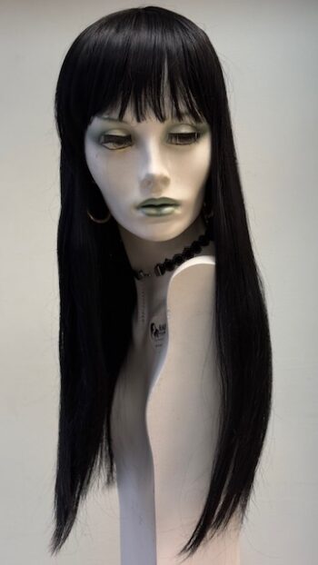 A mannequin with long black hair and green lipstick.