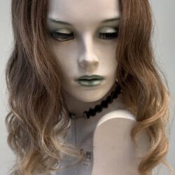 A mannequin with long hair and green eyes.