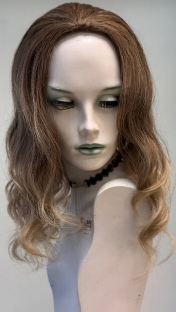 A mannequin with long hair and green eyes.