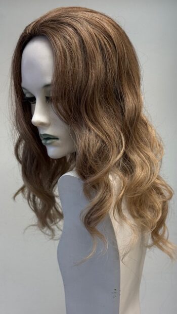 A mannequin with long hair and brown highlights.