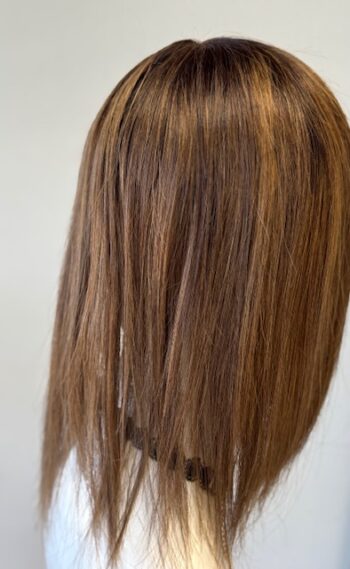 A close up of the back of a woman 's head