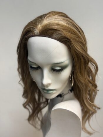 A mannequin with long hair and green eyes.