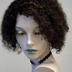 A mannequin with short hair and black beads.