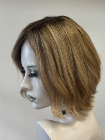 A mannequin head with a wig on it