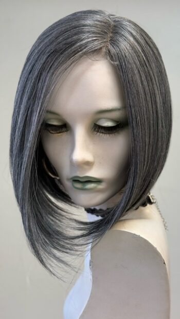 A mannequin with long hair and green eyes.