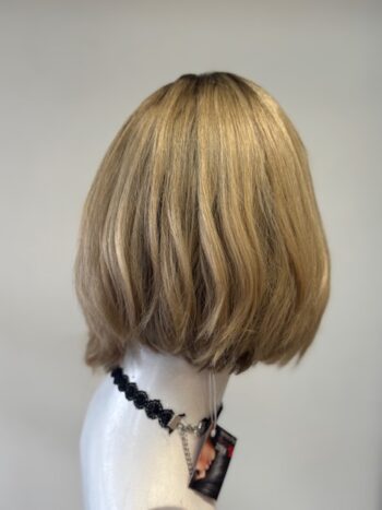 A mannequin head with blonde hair and necklace.