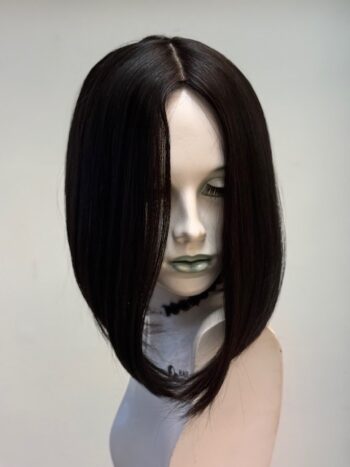 A mannequin wearing a wig with long hair.