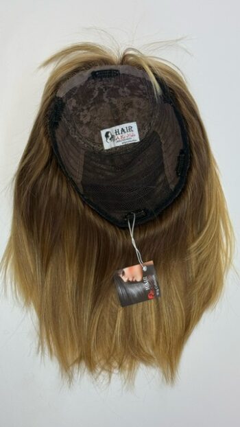 A wig with a tag hanging on it.