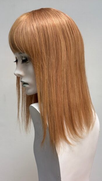 A mannequin with long blonde hair and bangs.