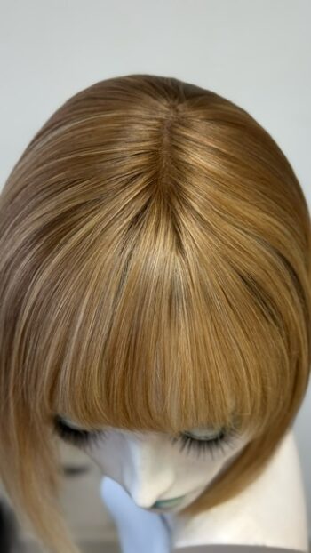 A close up of the back of a woman 's head