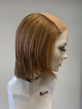 A mannequin head with a wig on it