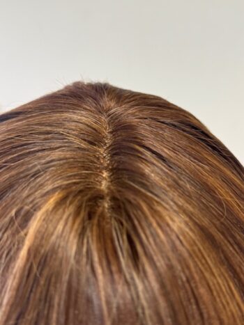 A close up of the back end of a woman 's head