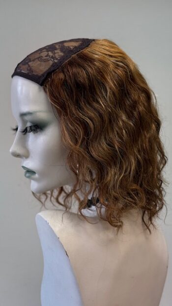 A mannequin with long hair and a headband.