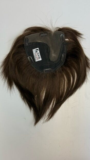 A brown wig with long hair on top of it.