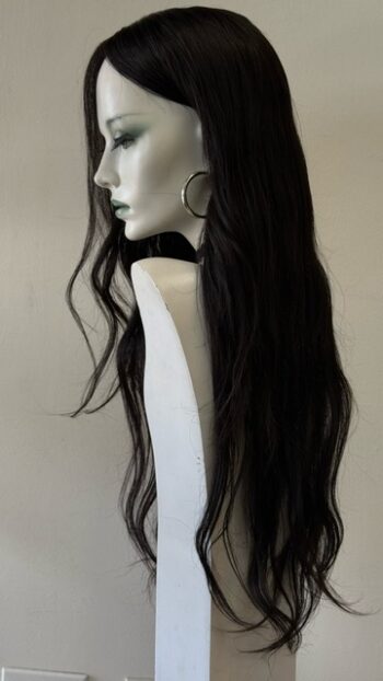 A mannequin with long black hair and large hoop earrings.