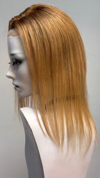 A mannequin head with long blonde hair.