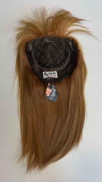 A wig is shown with long hair on top of it.