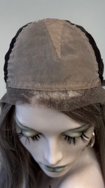 A close up of the hat on a mannequin head