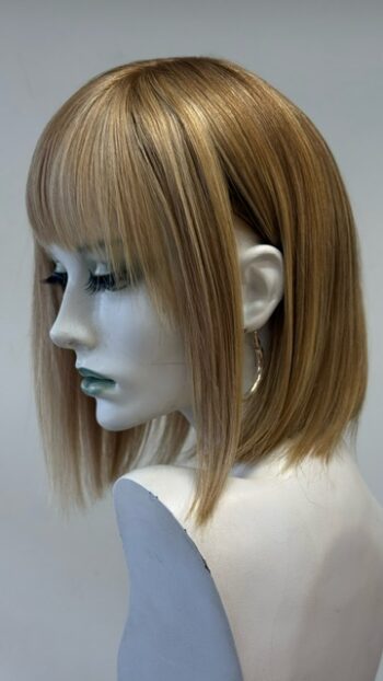 A mannequin with long blonde hair and bangs.