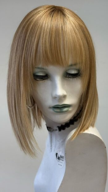 A mannequin with long blonde hair and bangs.