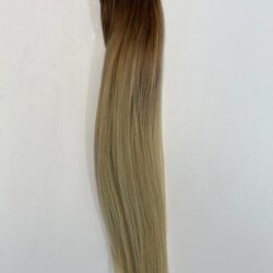 A long blonde hair extension is shown.