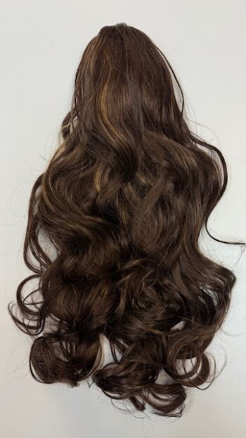 A long brown hair with lots of curls on top.